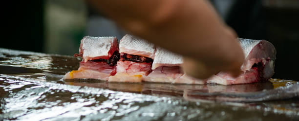 slicing fresh fish at street market. - tuna steak tuna prepared ahi meat imagens e fotografias de stock