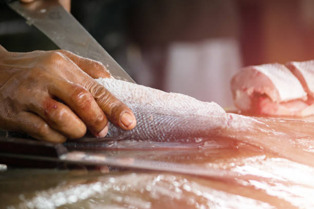 slicing fresh fish at street market. - tuna tuna steak raw freshness imagens e fotografias de stock