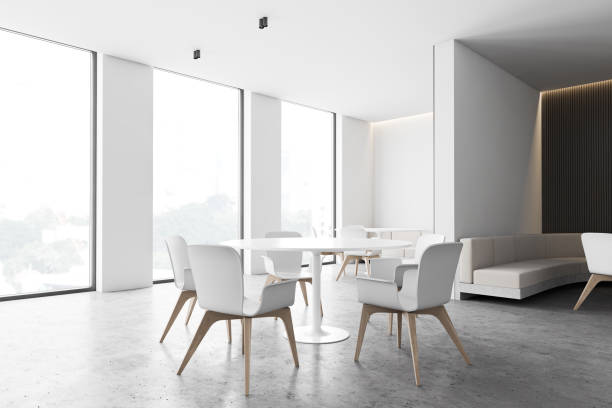istock White and gray cafe corner with round tables 1214549273