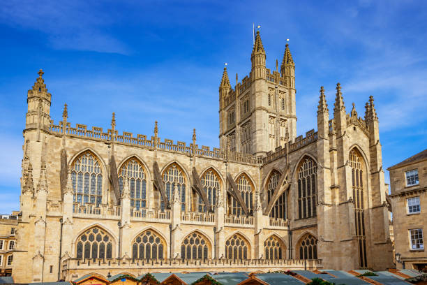 Bath Abbey in downtown Bath England UK The majestic Bath Abbey in downtown Bath England UK on a sunny day bath abbey stock pictures, royalty-free photos & images