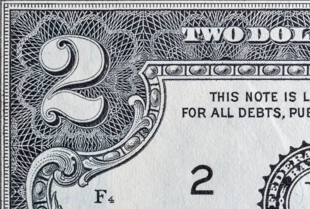 istock Corner of US two dollar bill macro. 1214557103