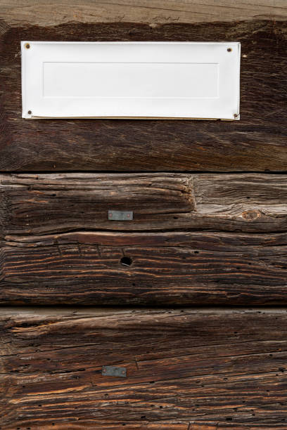 istock Old wooden wall with sign and copy space. 1214557108