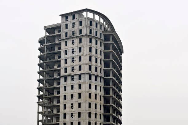 istock Concrete gray high-rise building partially without external walls. Background 1214558358
