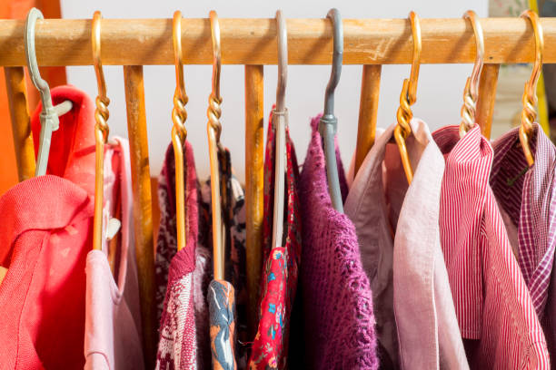 istock Lot of different clothes on hangers. Copy space 1214558640