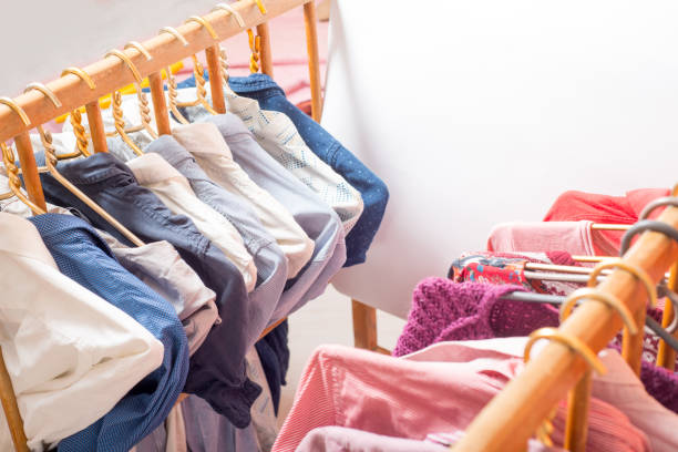 istock Lot of different clothes on hangers. Copy space 1214558797