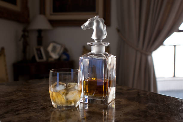 bottle and glass of whiskey - whisky liqueur glass alcohol bottle imagens e fotografias de stock