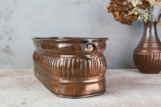 istock Antique copper flower pot 1214565485