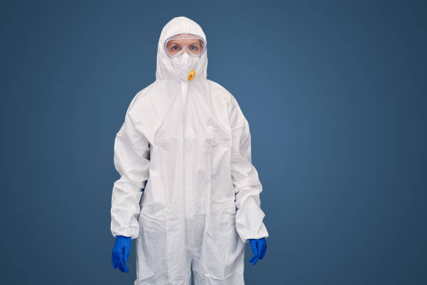 istock Qualified doctor in protective suit and special respirator mask 1214567891