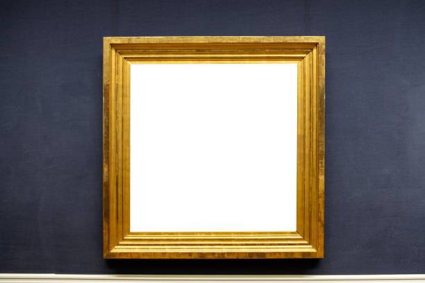 istock Blank antique golden carved picture frame on wall 1214567981