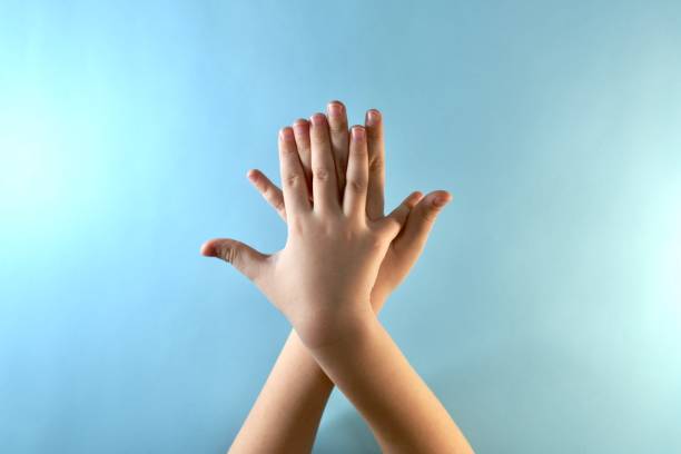 istock Phase 2 of hand processing in antiseptic. Processing external between the finger zones. 1214568210