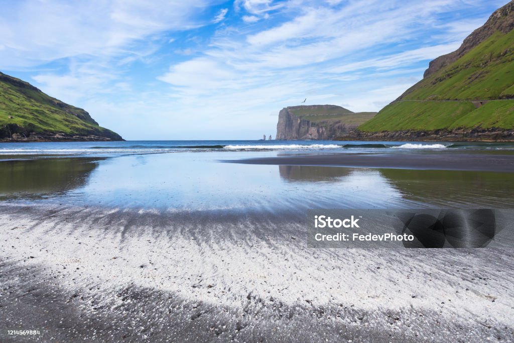 Tjørnuvík beach with Risin and Kellingin sea stacks in the distance at Tjørnuvík, Streymoy, Faroe Islands, Denmark Atlantic Ocean Stock Photo