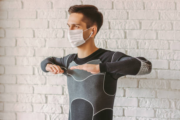 istock Sports man doing exercises at home 1214570664