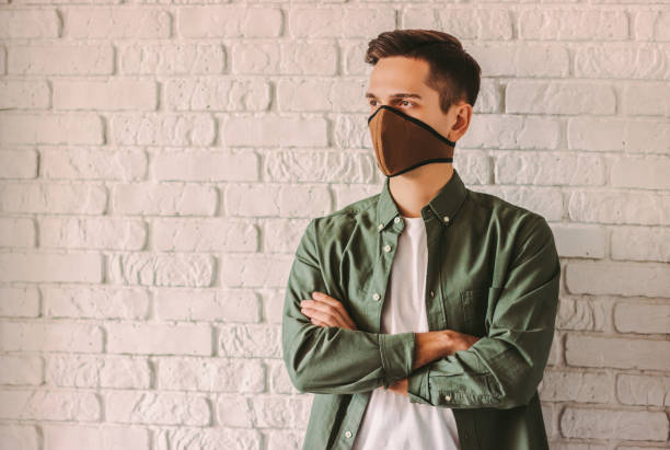 istock Young man in professional respirator for personal protection 1214570908
