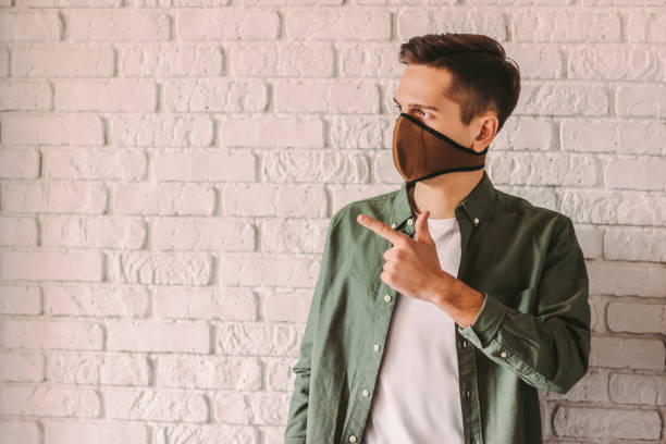 istock Coronavirus protective measures of young hipster man 1214570921