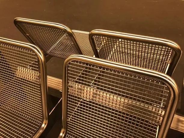 Photo of Metallic sitting chairs in a railways stations in Berlin