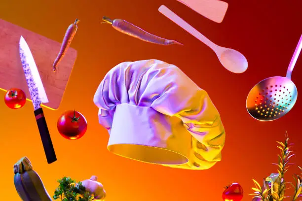 White Cook Hat or Toque, Cutlery, Dishware, Kitchenware, Utensils and Food Ingredients on Orange Background Illuminated By Yellow Light. 3d rendering.