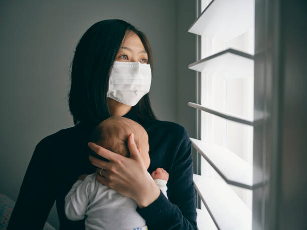 a mother and baby in home isolation from infectious disease. - mother family baby isolated imagens e fotografias de stock