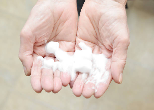 istock Senior Woman with Hand Sanitizer 1214572790