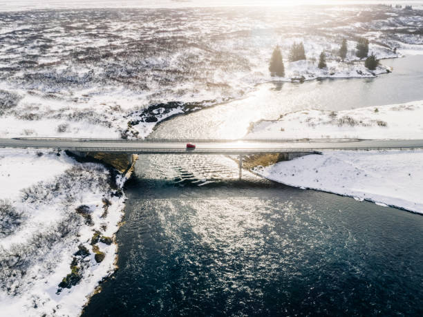 istock Beautiful view of a bridge over a river on a sunny winter’s day 1214575401