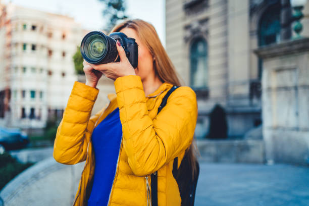istock Woman tourist taking photos 1214576100