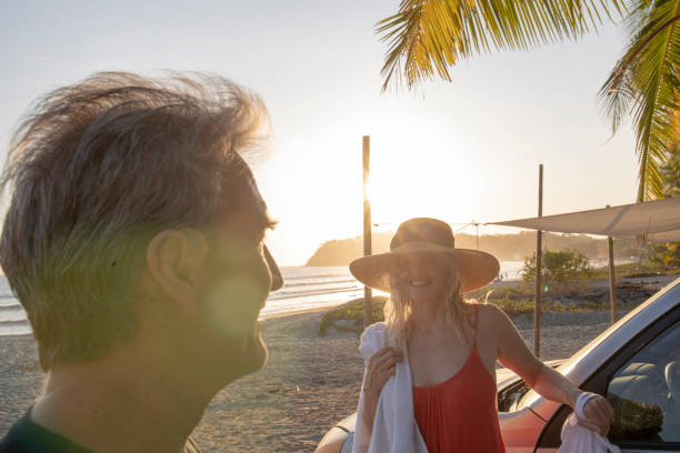 istock Couple relax on tropical beach 1214578497