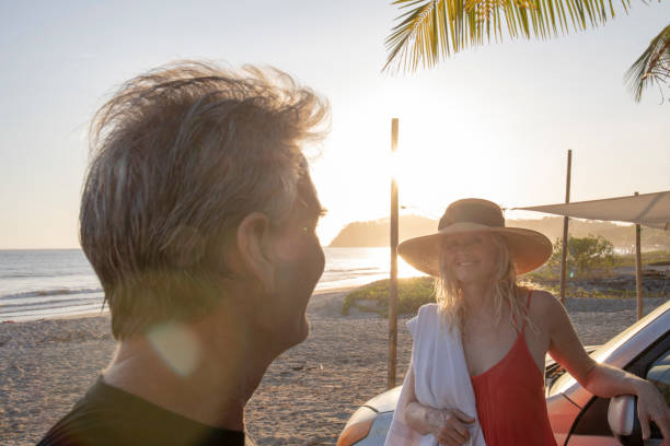 istock Couple relax on tropical beach 1214578532