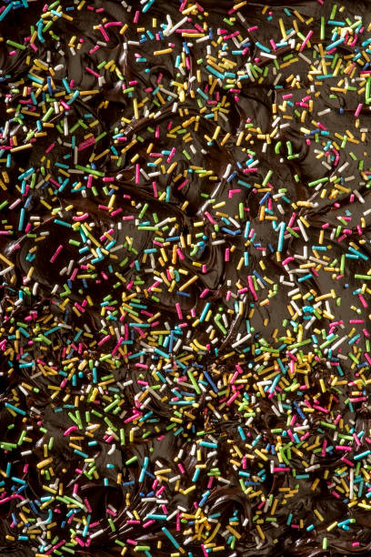 istock Small colorful candies poured on chocolate pudding 1214580650