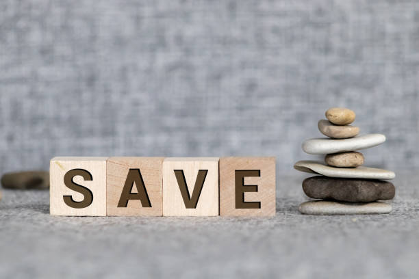 istock SAVE word written on wood block. Wooden abc. 1214583458