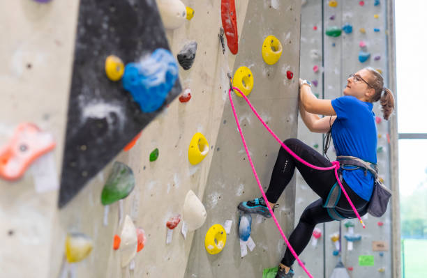 istock Young Woman Indoor Rock Climbing 1214589646