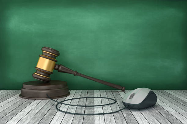 istock Legal Gavel with Computer Mouse on Chalkboard - 3D Rendering 1214591998