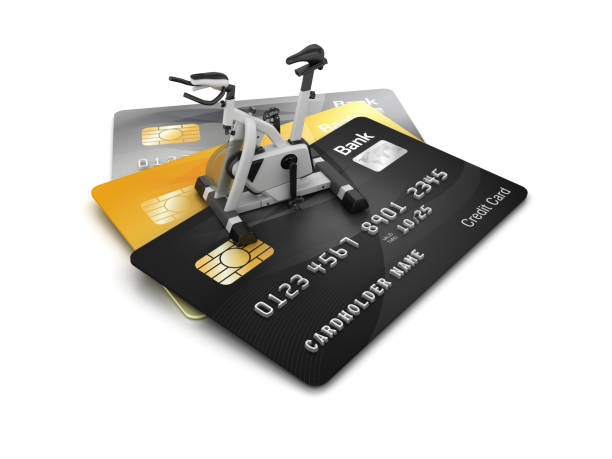 istock Credit Cards with Exercise Bike - 3D Rendering 1214592656