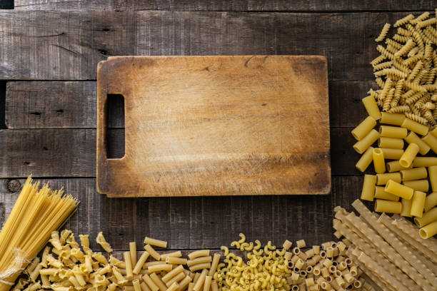 Variation of raw pasta with copy space