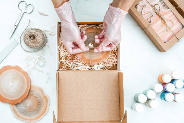 istock Creativity and craft. A young girl creates coasters from resin. Gift wrapping. Decorative packaging. Idea for business. Remote work, work at home. Art coasters. 1214593831