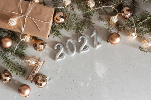 istock New Year 2021 silver balloons with fireworks 1214593893