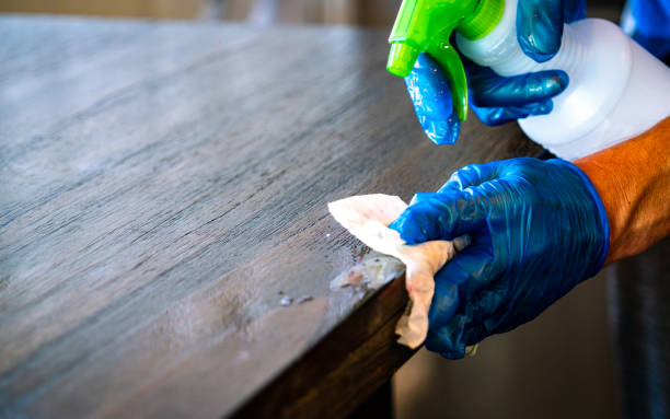 istock Cleaning the edge of a table fighting Covid-19 1214599162