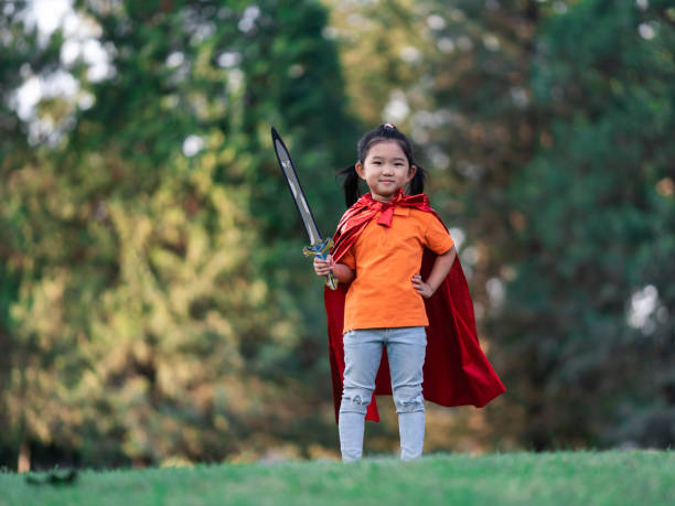 istock Wonder Girl Holding a Sword 1214599913