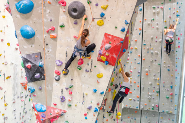 istock Young Woman Indoor Rock Climbing 1214601669