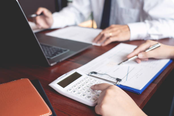 istock working together in office concept, young businessmen using touchpad digital tablet to discuss the situation on the market or stock yield graph chart at meeting office 1214605254