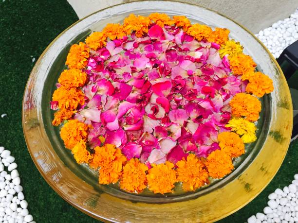 istock Flower petals arranged in a water basin 1214608884