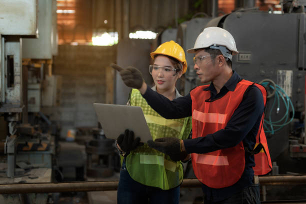 istock two engineer with laptop in factory 1214608981