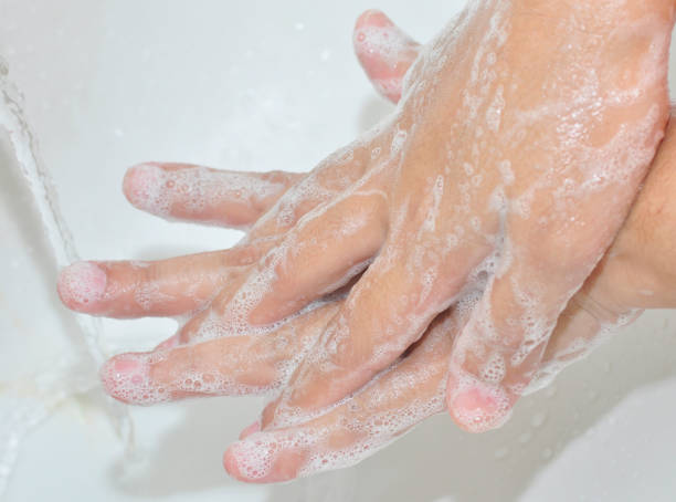 istock Corona virus pandemic prevention wash hands with soap. 1214609987
