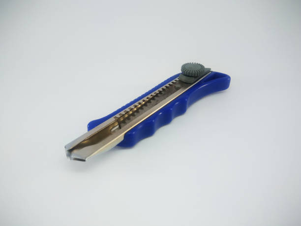 istock Blue Office Paper Knife Isolated On a White Background 1214610616