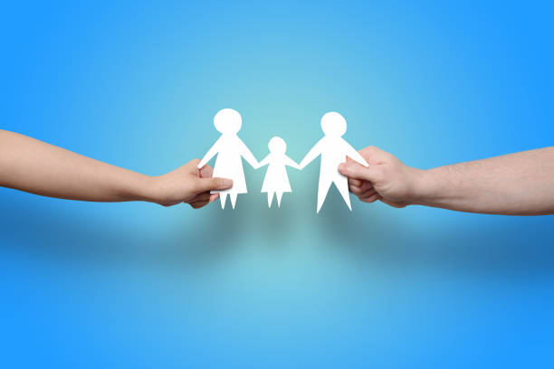 istock Paper cut out hands holding family 1214610695