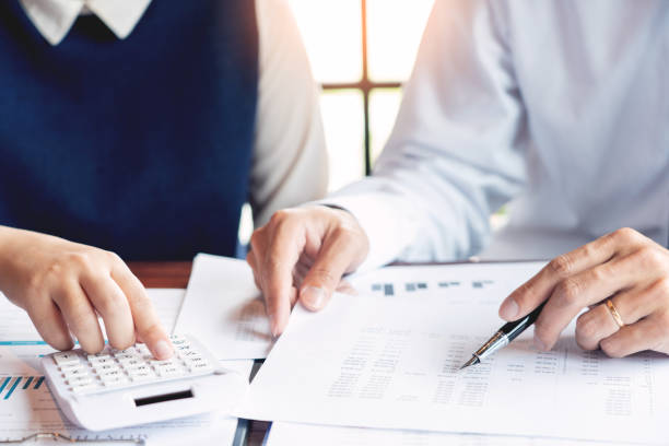 istock working together in office concept, young businessmen using touchpad digital tablet to discuss the situation on the market or stock yield graph chart at meeting office 1214610941