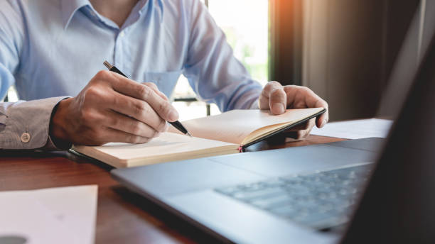 istock strategy analysis concept, Businessman working  financial Manager Researching Process accounting calculate analyse market graph data stock information review on the table in office. 1214611212