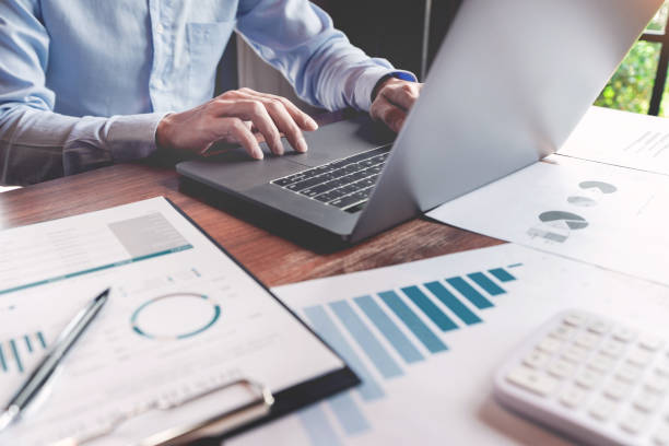 istock strategy analysis concept, Businessman working  financial Manager Researching Process accounting calculate analyse market graph data stock information review on the table in office. 1214611757