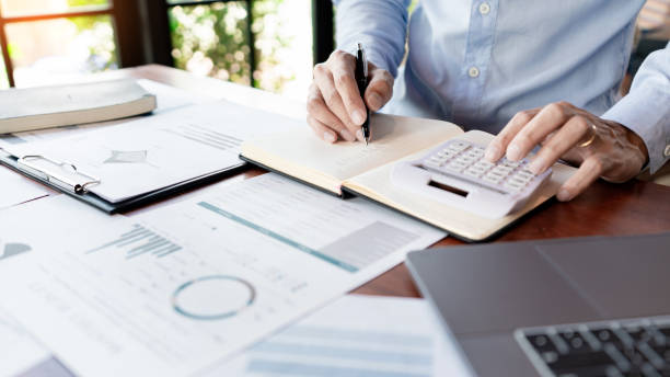 istock strategy analysis concept, Businessman working  financial Manager Researching Process accounting calculate analyse market graph data stock information review on the table in office. 1214611870