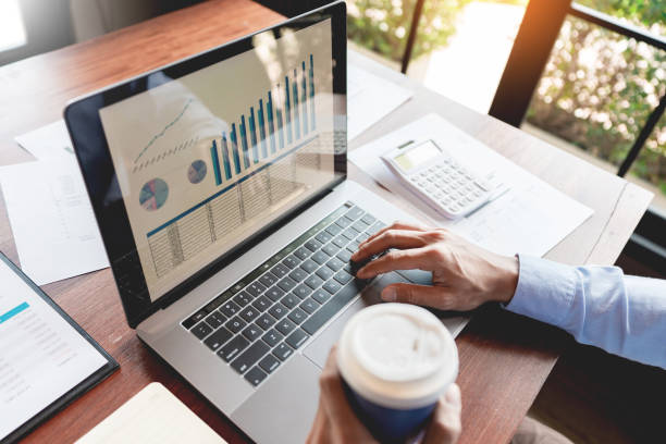 istock strategy analysis concept, Businessman working  financial Manager Researching Process accounting calculate analyse market graph data stock information review on the table in office. 1214611953