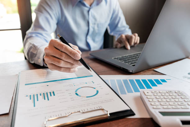 istock strategy analysis concept, Businessman working  financial Manager Researching Process accounting calculate analyse market graph data stock information review on the table in office. 1214612034