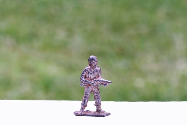 A tin soldier on the background of the flag of Pakistan. India Pakistan military conflict